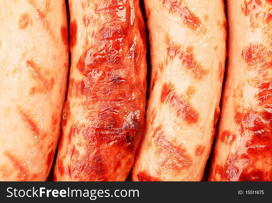 Close-up of appetizing grilled sausages. Close-up of appetizing grilled sausages.