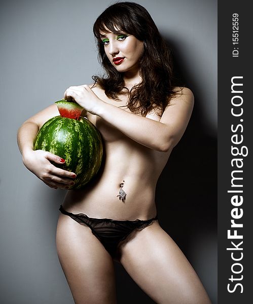 Girl with watermelon in studio