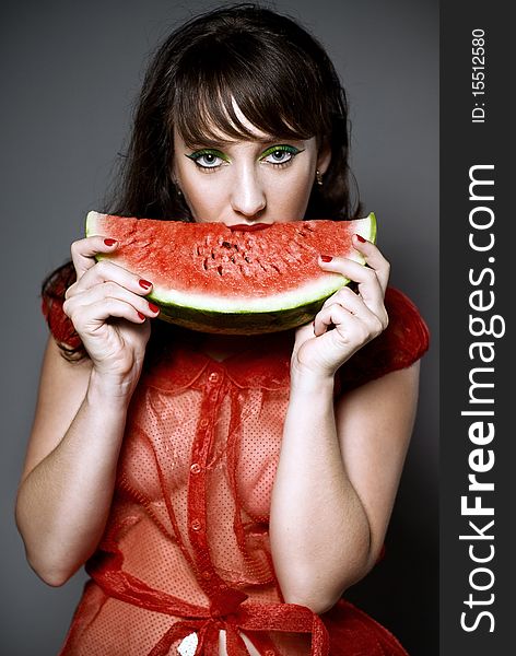 Girl with watermelon in studio