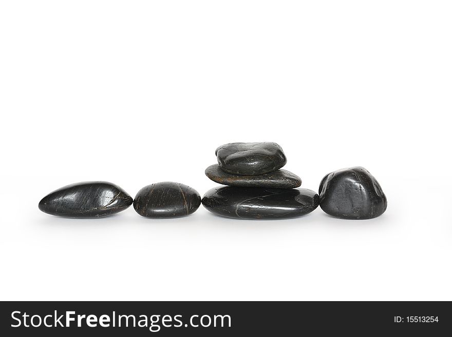 Few black stones isolated on white background with clipping path. Few black stones isolated on white background with clipping path