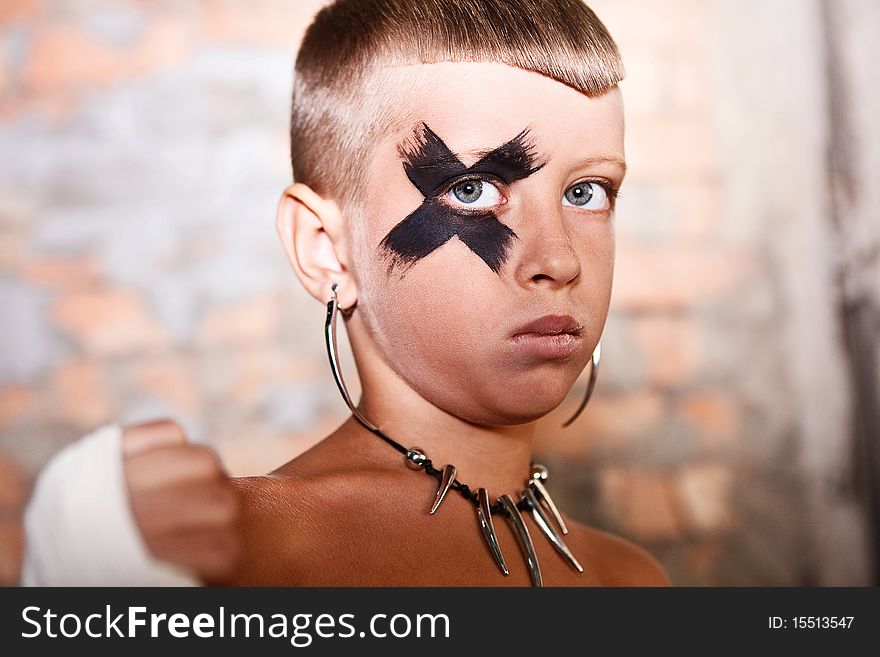 Little kick-boxing boy on the grange background. Little kick-boxing boy on the grange background