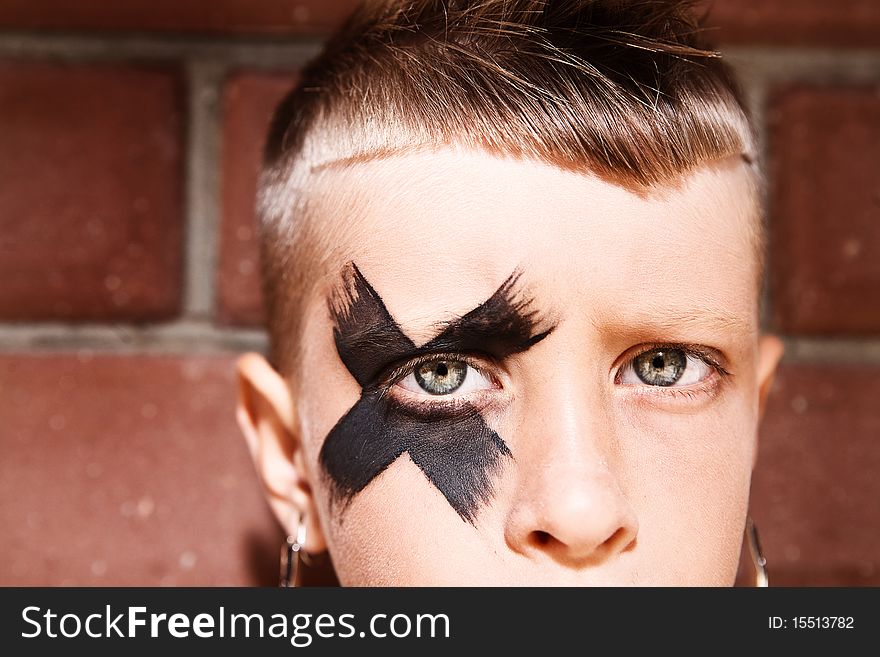 Little kick-boxing boy on the grange background. Little kick-boxing boy on the grange background