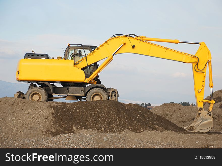 Yellow bulldozer for moving to sand