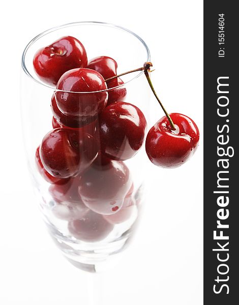 Cherries in a cup  on white background