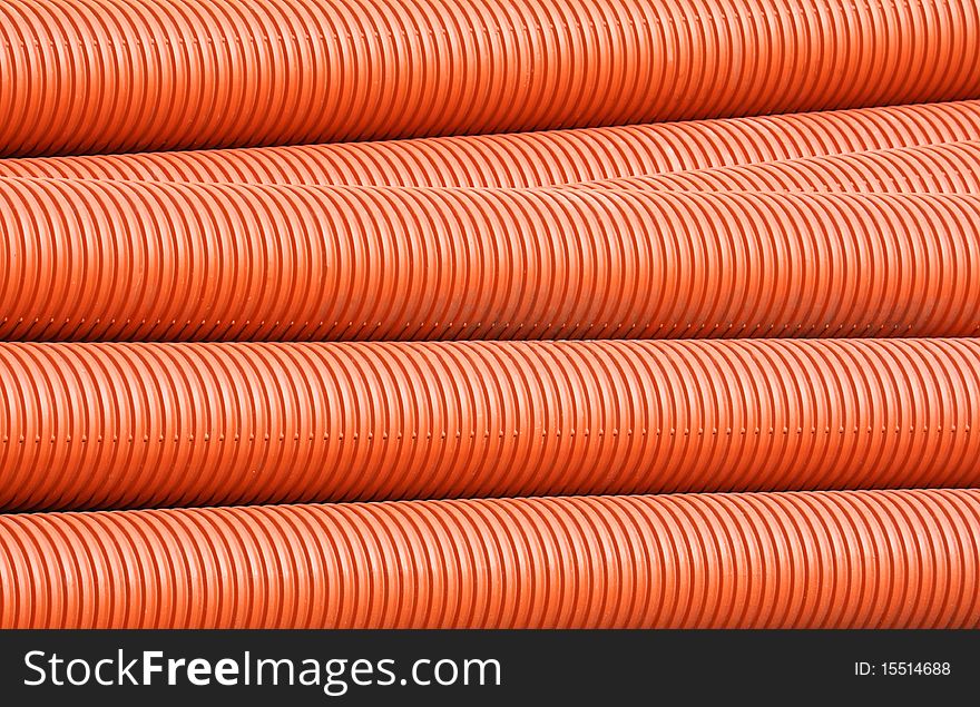 Colorful plastic plumbing tubes stacked in storage
