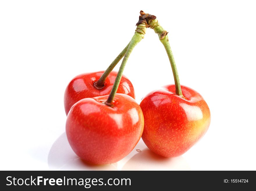 Few cherries on white background