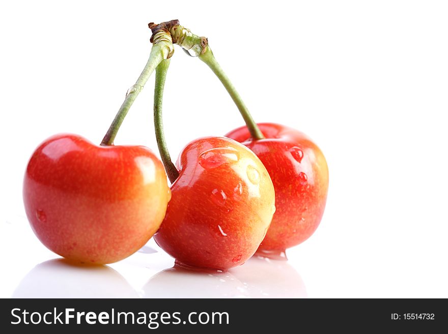 Few cherries on white background