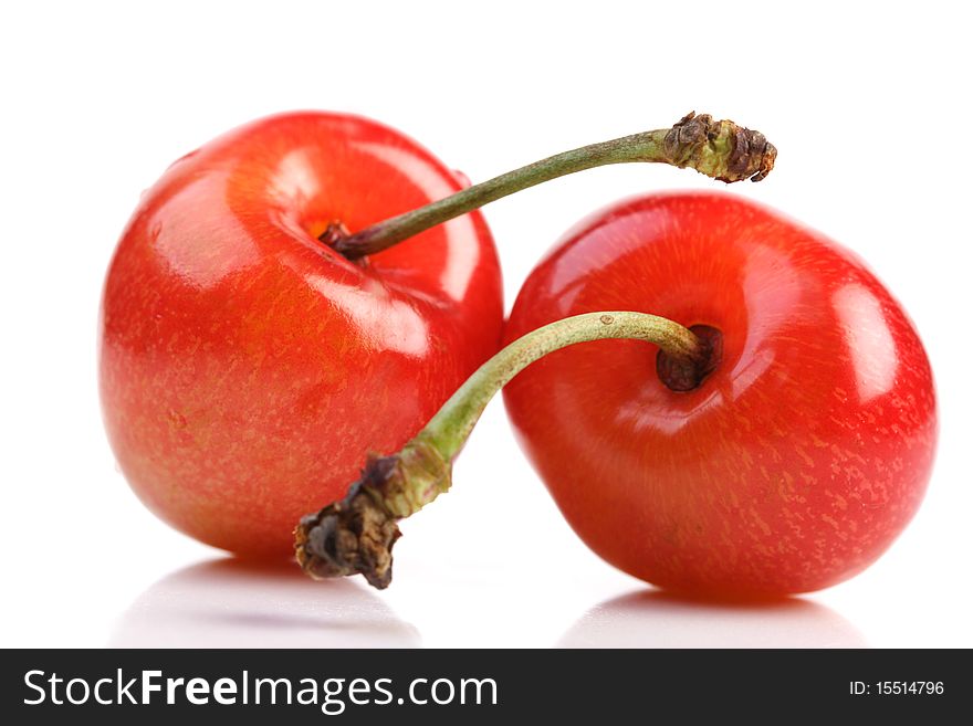 Few cherries on white background