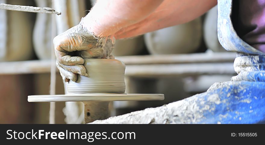 Making of a ceramic vase inside of workshop