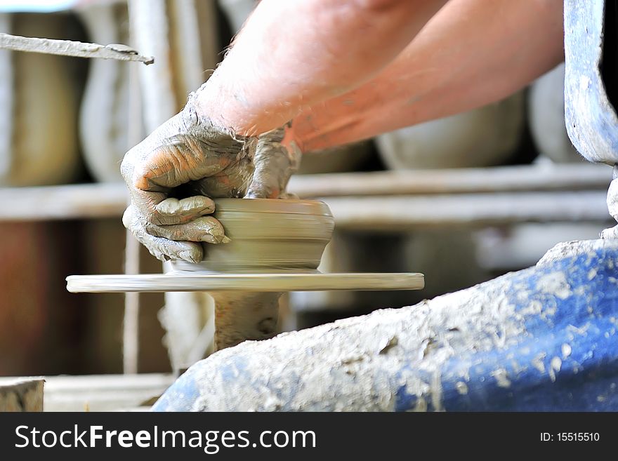 Making of a ceramic vase inside of workshop