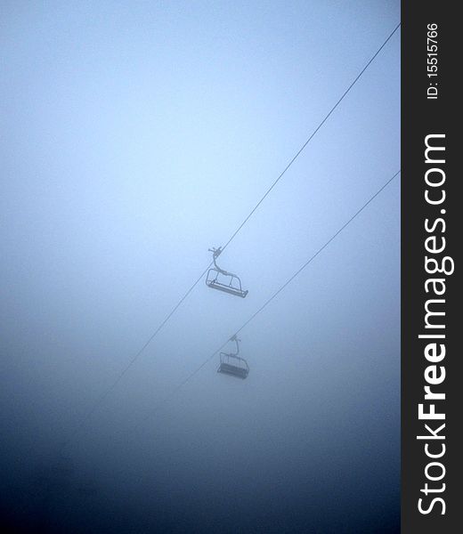 Some chairlifts in the clouds on the Vogel Mountain in Slovenia