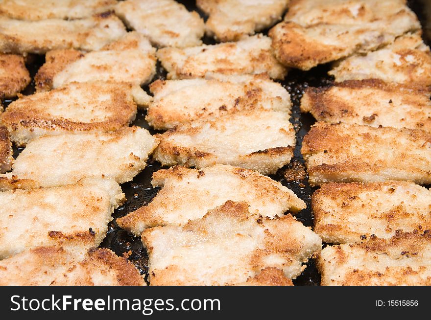 Meat pieces in crackers fried in oven. Meat pieces in crackers fried in oven