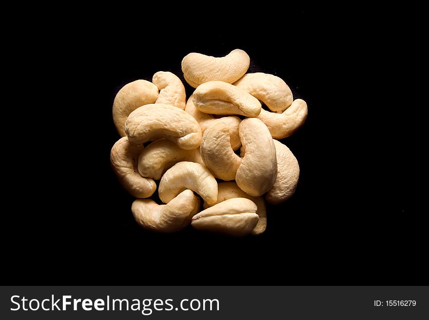 Cashew nuts isolated on black background. Cashew nuts isolated on black background