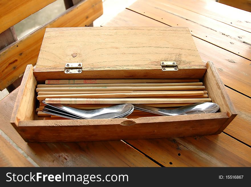 Spoons and Chopsticks in wood box. Spoons and Chopsticks in wood box