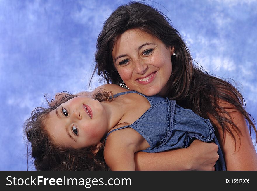 Mother and daughter playing on a studio session