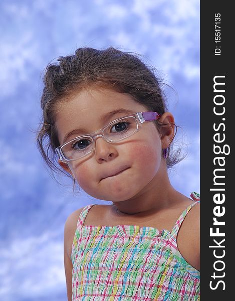 A sweet little girl with glasses