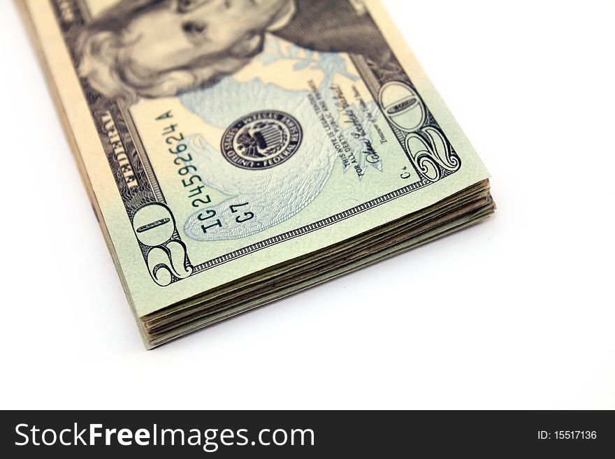 Stack of twenty dollar bills over white background