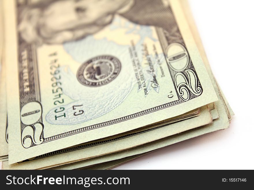 Stack of twenty dollar bills over white background