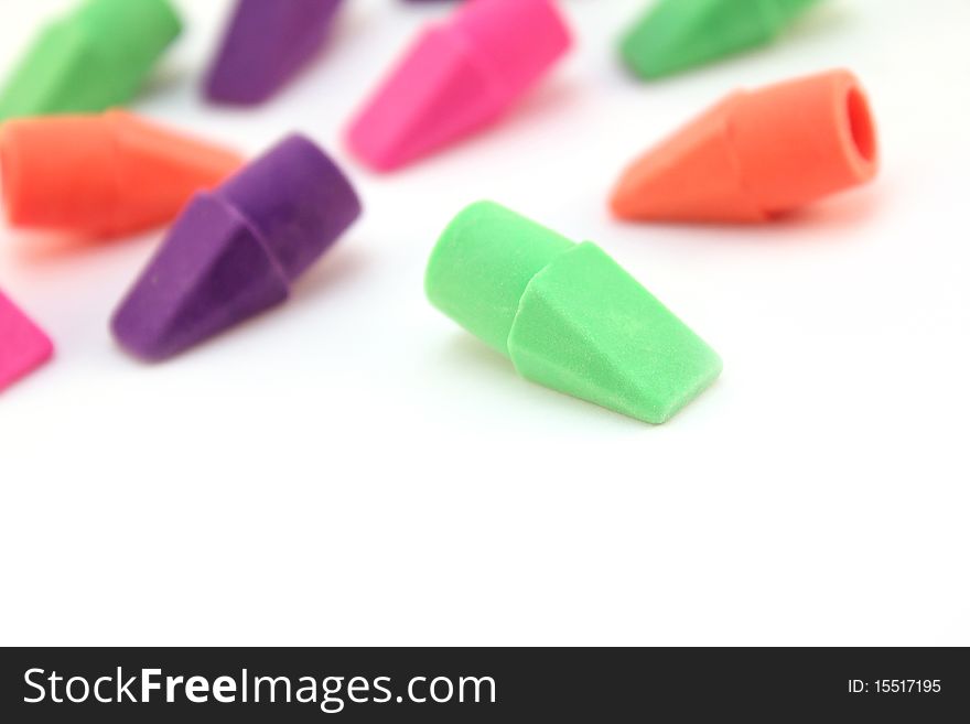 Brightly colored erasers isolated over white background
