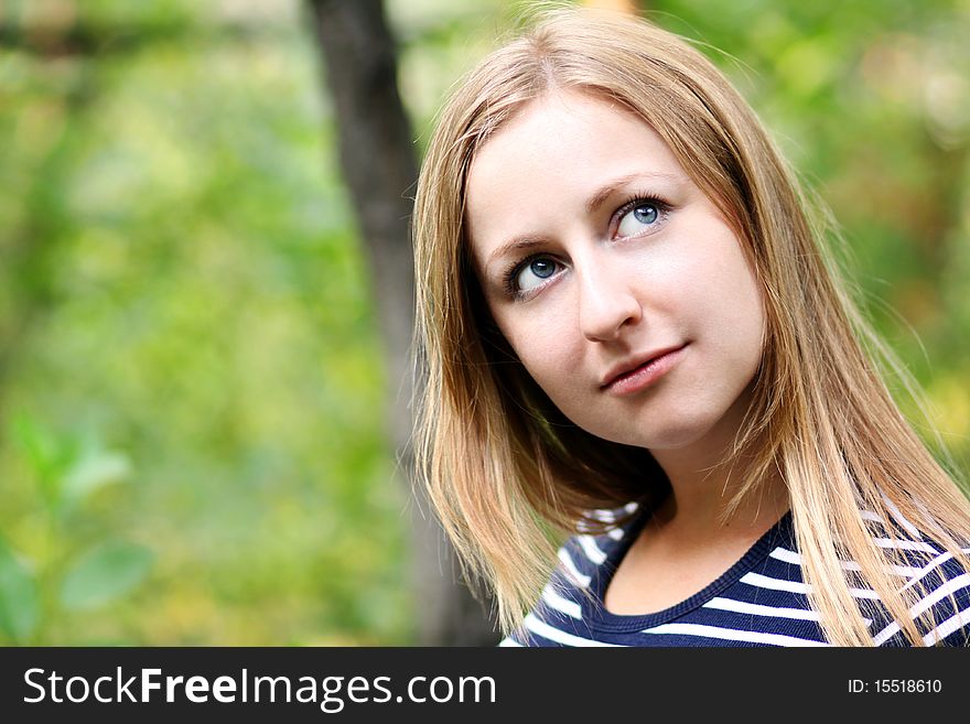 Beautiful young girl smiling. Outdoor portrait