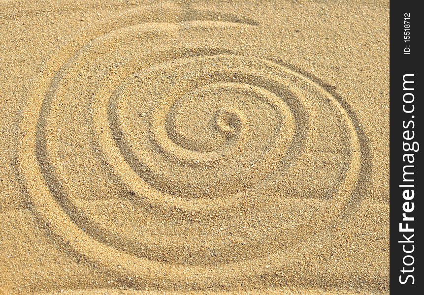 Photo Of Spiral Pattern In The Sand
