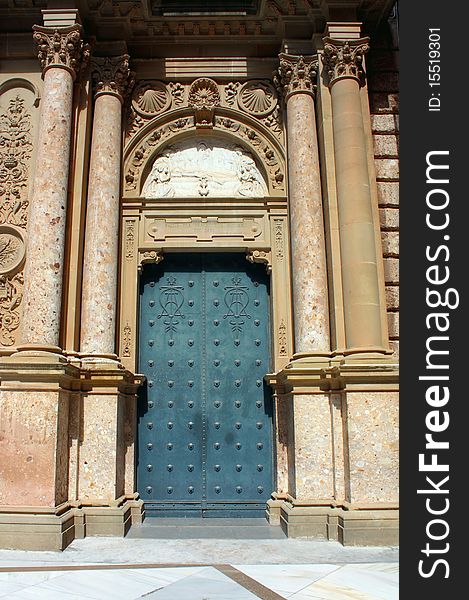 Blue steel door and marble columns closeup. Blue steel door and marble columns closeup