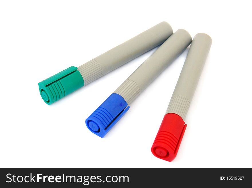 Three colored markers isolated on white background. Three colored markers isolated on white background