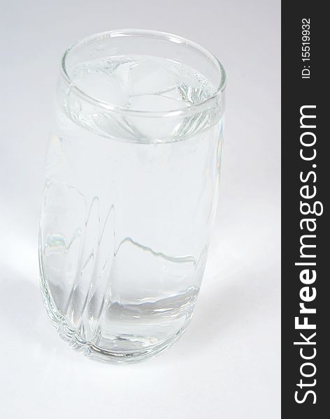 Glass of water on grey background