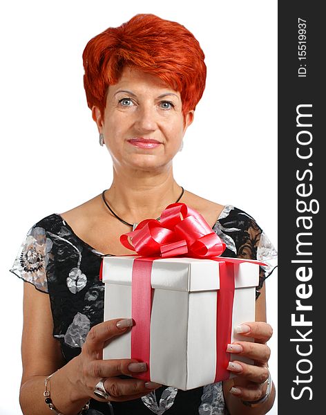 Mature woman with gift box isolated on white