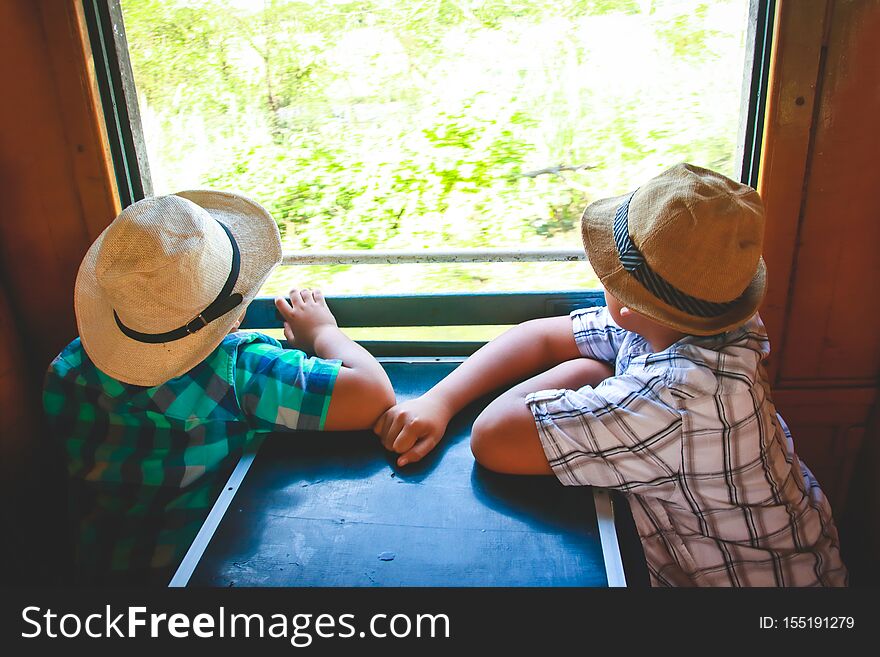 Two boys boarding a train to travel Sitting at the window view. Two boys boarding a train to travel Sitting at the window view