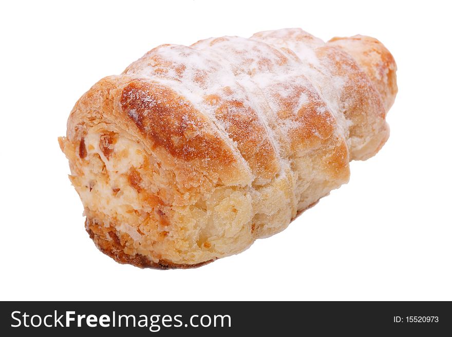 Cake in the form of tubes with whipped cream. Isolated on a white background.