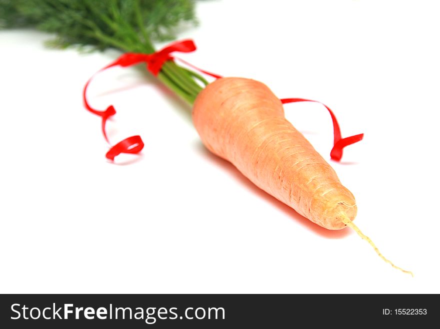 Fresh Carrots With Red Ribbon Isolated on a White Background