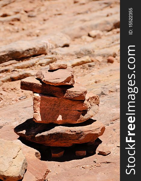 A cairn marking the way on a desert trail