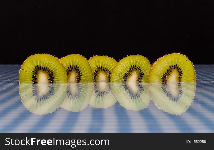 Kiwi Slices with Reflection On Picnic Cloth