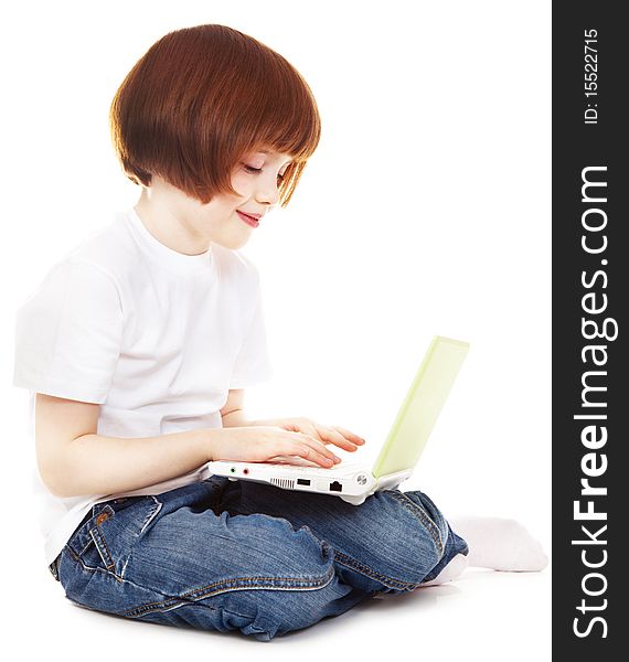 Little girls with a laptop over white