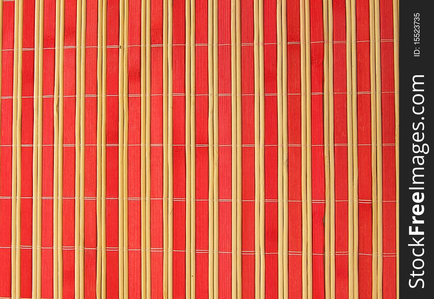 Bamboo mat in red and yellow stripes. Bamboo mat in red and yellow stripes