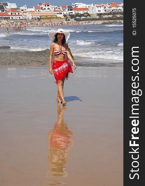 Beautiful girl walking on the beach