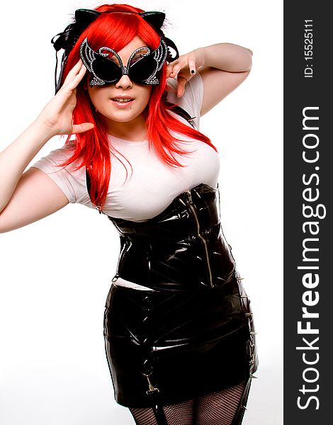 Girl in red wig and latex posing. Girl in red wig and latex posing
