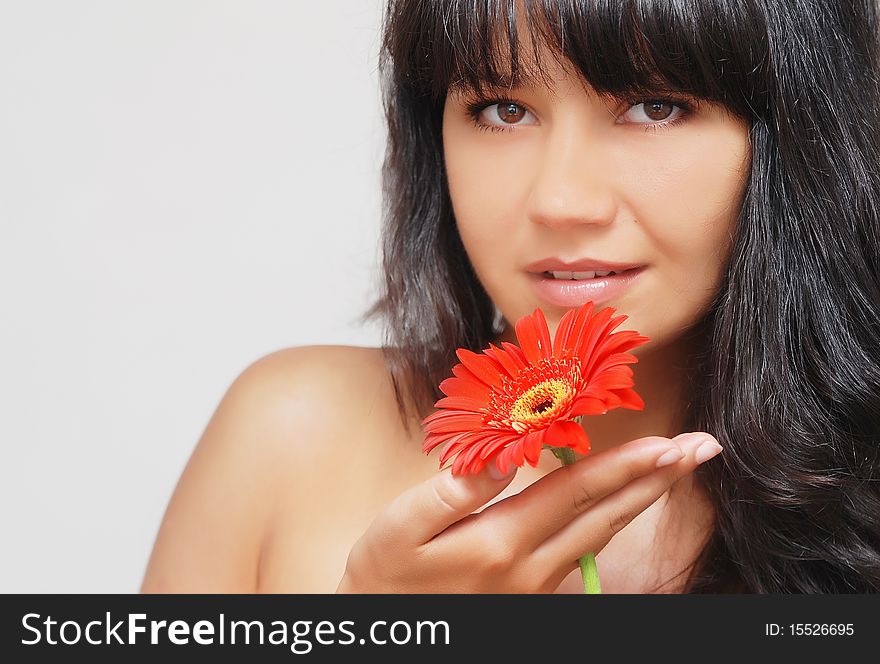 Fashionable young woman with flower