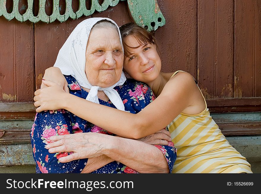 Grandmother and granddaughter embraced and happy outdoor