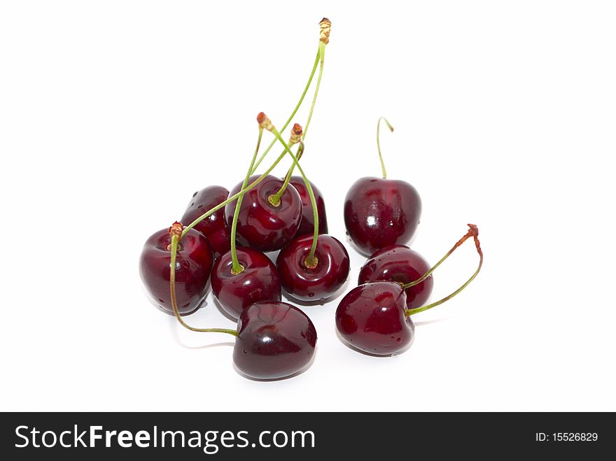 Cherries with green stems isolated on white. Cherries with green stems isolated on white