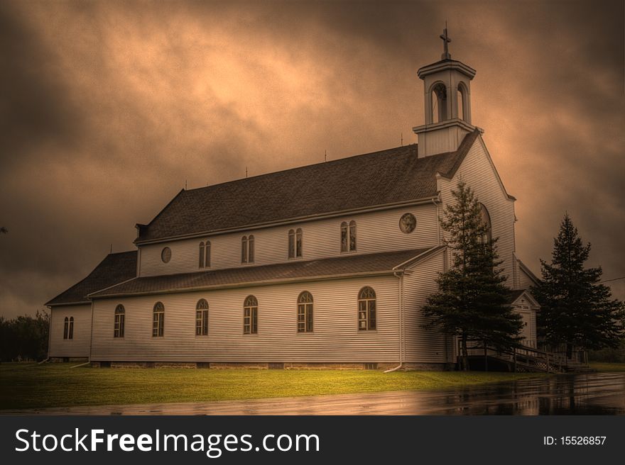 This is an HDR image of an old, wooden Roman Catholic church in a small town called Adamsville, located near Moncton New Brunswick. This is an HDR image of an old, wooden Roman Catholic church in a small town called Adamsville, located near Moncton New Brunswick.