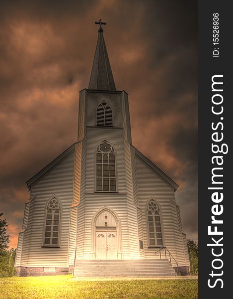 This is an HDR image of an old, wooden Roman Catholic church in a small villiage near Renous, in New Brunswick. This is an HDR image of an old, wooden Roman Catholic church in a small villiage near Renous, in New Brunswick.