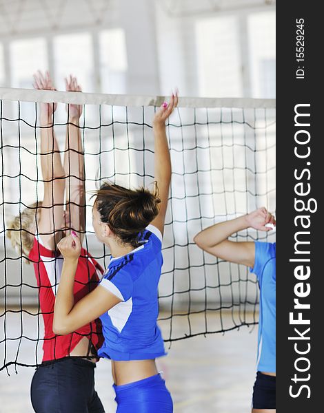 Volleyball game sport with group of young beautiful  girls indoor in sport arena. Volleyball game sport with group of young beautiful  girls indoor in sport arena