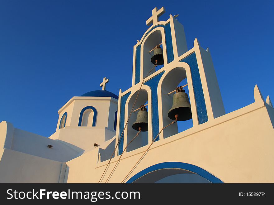 An isolated church in Santorini on the way to Pharos, kissed by the sunset. An isolated church in Santorini on the way to Pharos, kissed by the sunset.