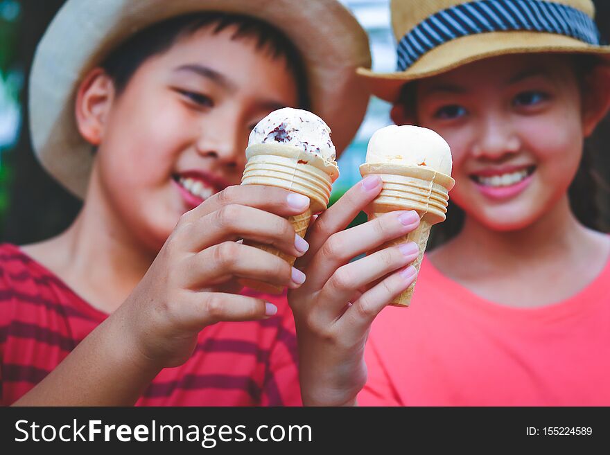 Boys and girls carrying ice cream