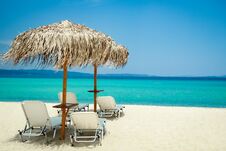 Beautiful Beach Chairs Near The Seashore Of Greece On The Nature Background Stock Photography