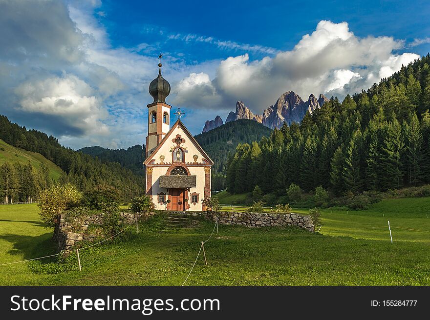 St. John church in front of the Odle mountains, Funes Valley, Dolomites, Italy