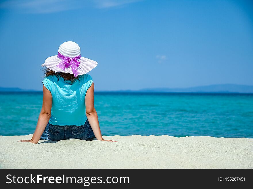 A happy girl at sea in greece on sand nature