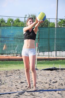 Girl Playing Beach Volleyball Stock Image